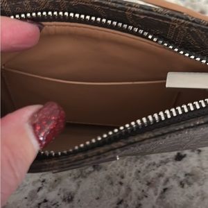 Ladies traveling large wallet by Calvin Kline. Used only once. Like new.